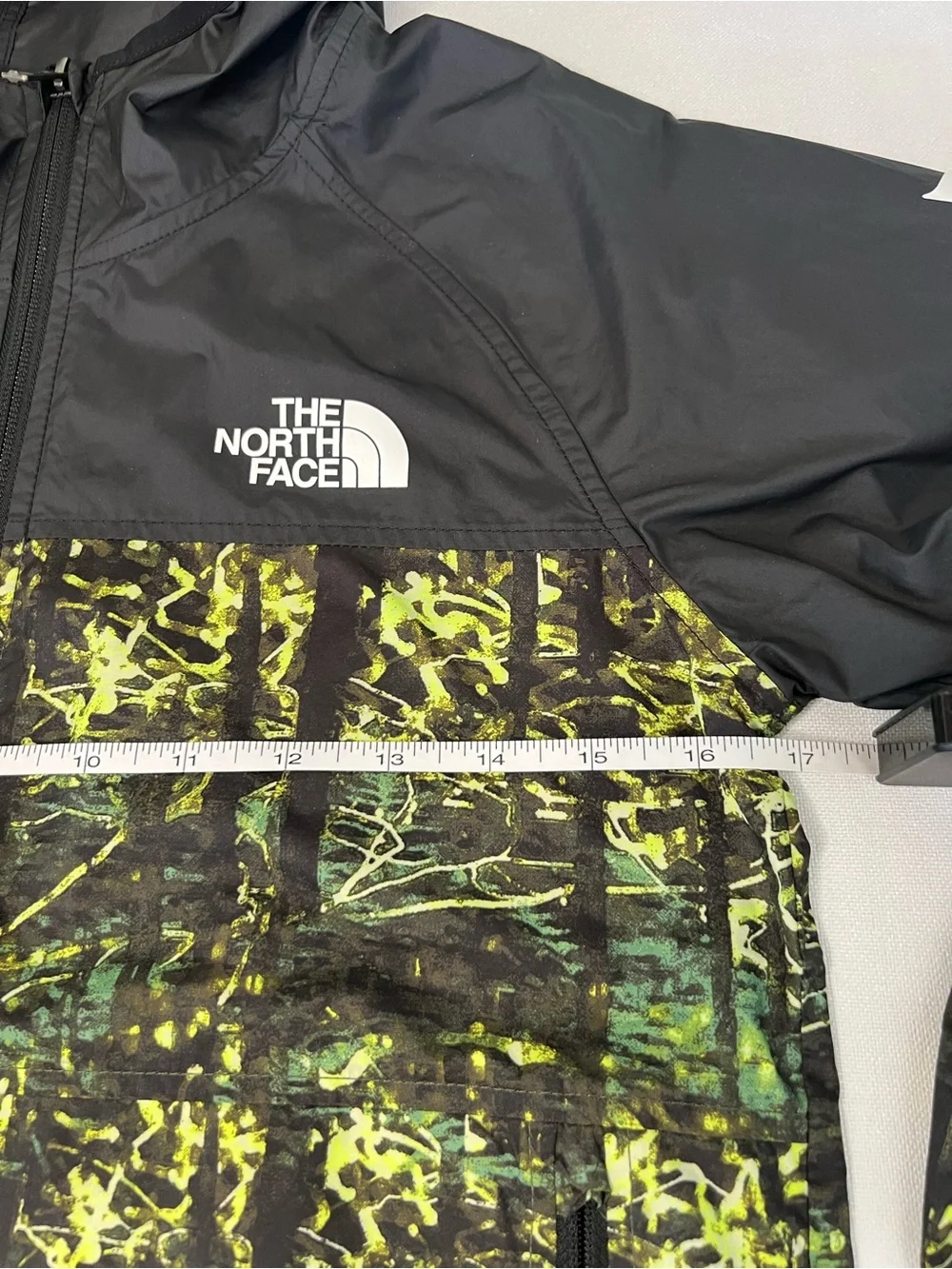The North Face Kids Black Hooded Rain Jacket with Neon Green Print